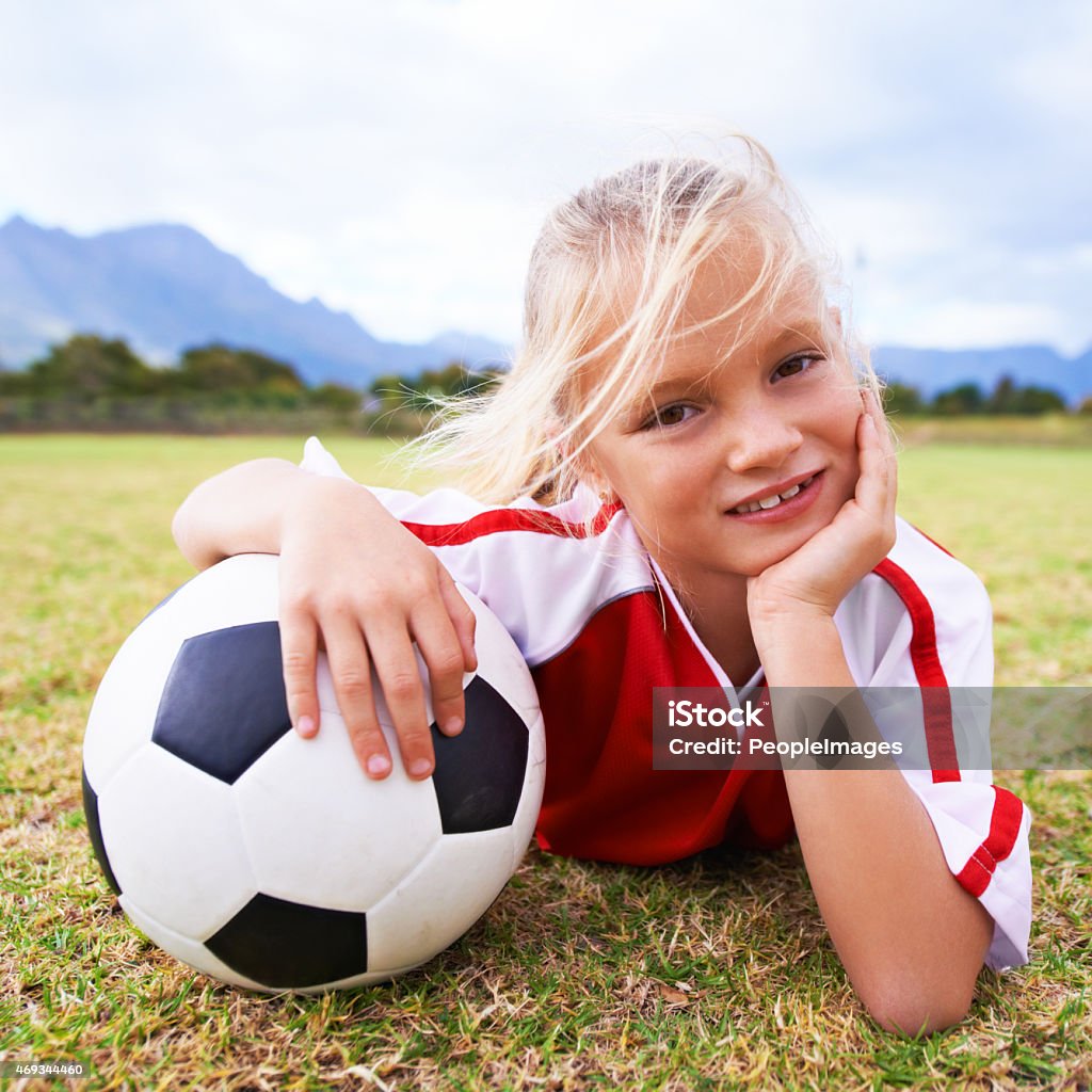 She's waiting for the rest of her team Portrait of a young girl lying on a soccer fieldhttp://195.154.178.81/DATA/i_collage/pi/shoots/782261.jpg 2015 Stock Photo