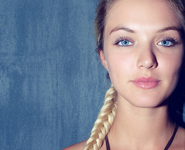 Beautiful young blonde woman with minimum makeup in good weather with visible freckles