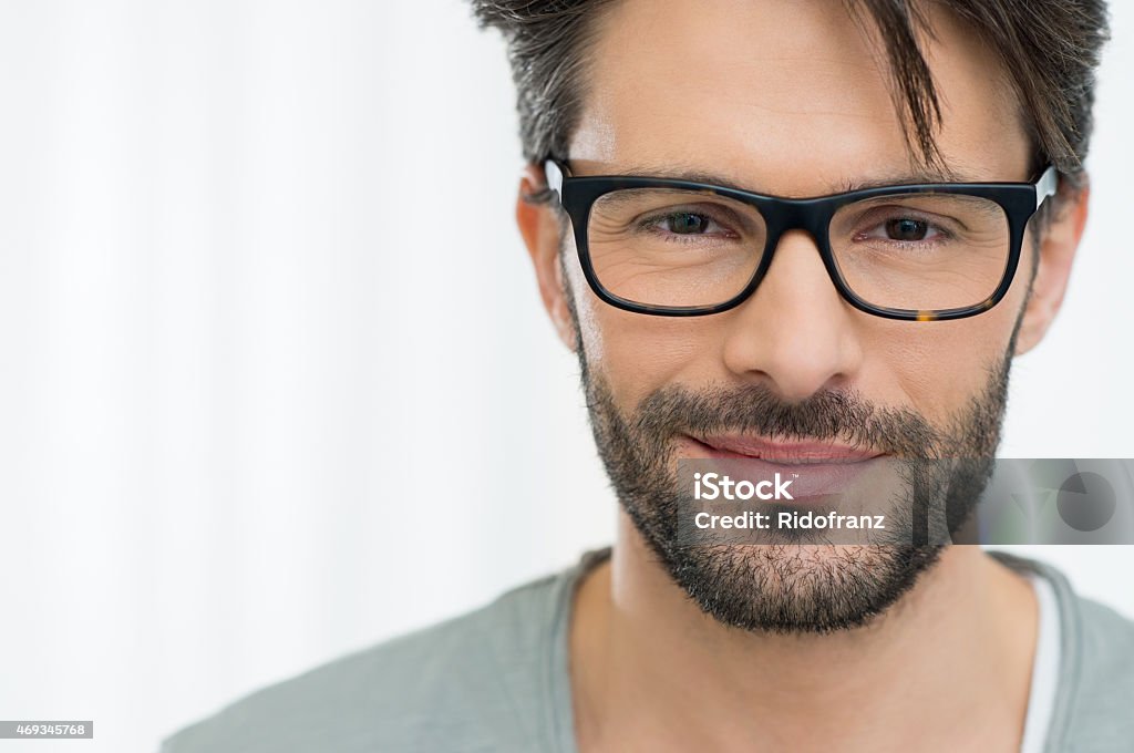 Satisfied man with spectacle Closeup of smiling man wearing eyeglass Smug Stock Photo