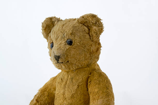 istock Torso of an old brown teddybear, left side 469346062