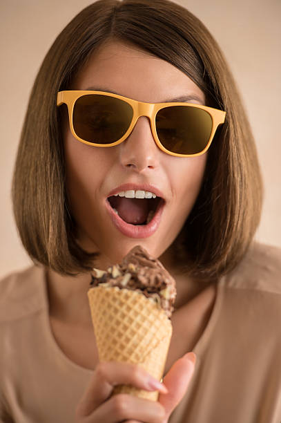 istock Ice cream woman singing in cone like in microphone 469347274