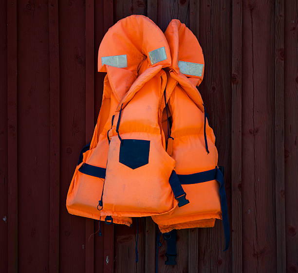 giacca di salvataggio - life jacket isolated red safety foto e immagini stock