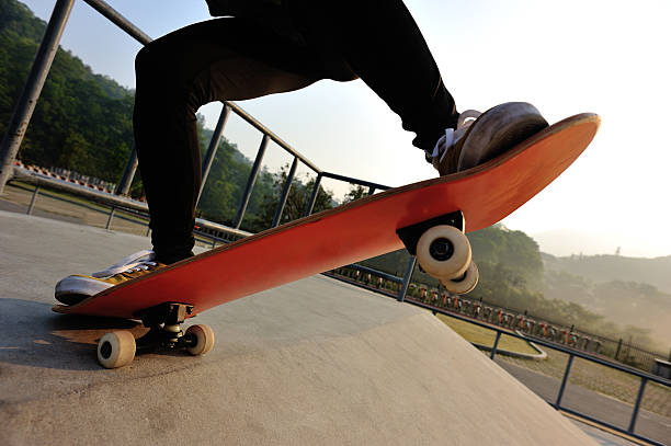 istock skateboarding jumping at skatepark 469351002