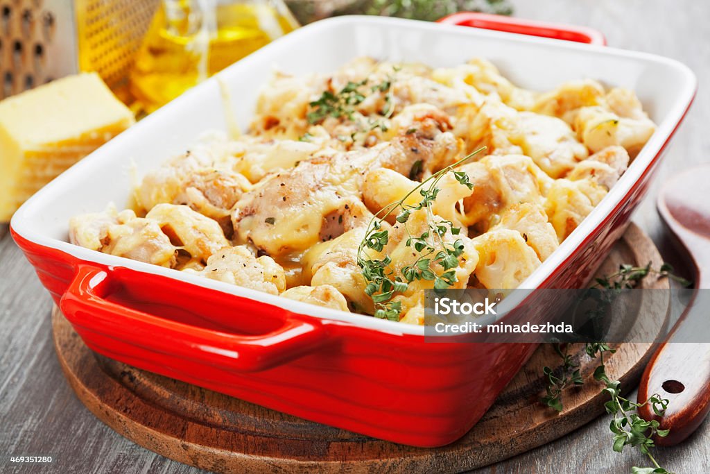 Casserole with cauliflower and chicken Casserole with cauliflower, chicken and cheese in a ceramic pot Chicken Meat Stock Photo