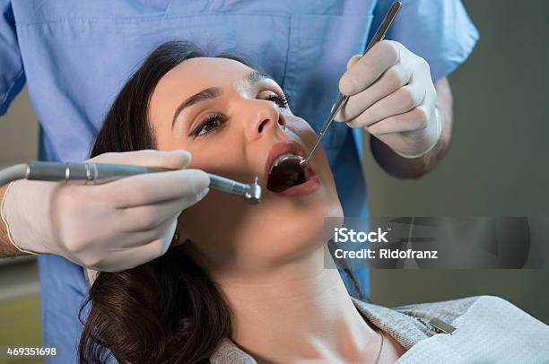 Dentist Working On Patient Stock Photo - Download Image Now - 2015, Adult, Adults Only