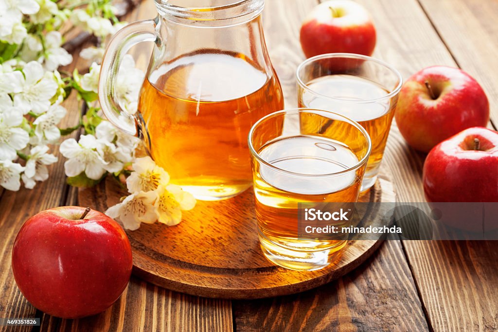 Apple juice Apple juice  in the glass jug on the table 2015 Stock Photo