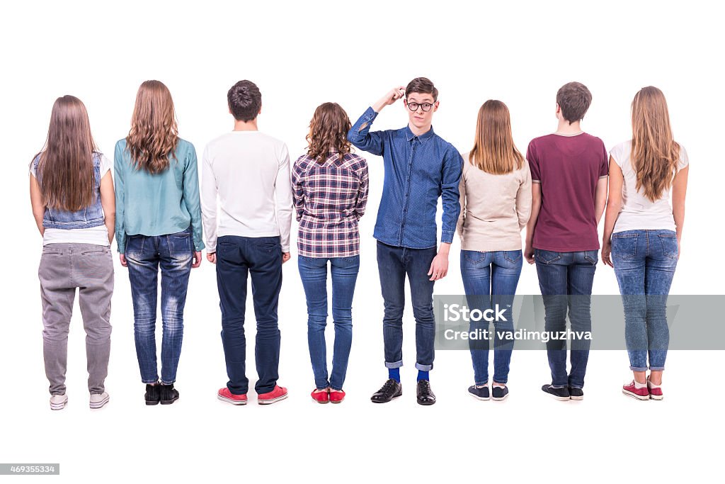 People group Full length. Young group standing with his back to the camera except one guy. isolated on white background. 2015 Stock Photo