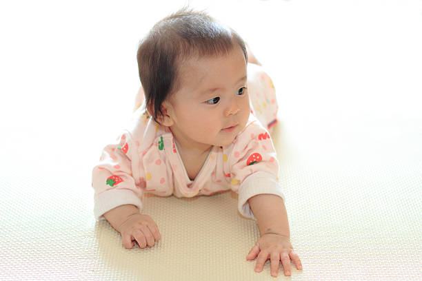istock Crawling baby girl 469355356
