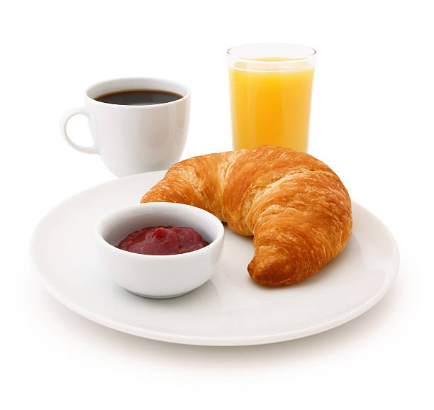 Continental Breakfast Continental Breakfast: croissant, jam, coffee and orange juice isolated on white (excluding the shadow) continental breakfast stock pictures, royalty-free photos & images