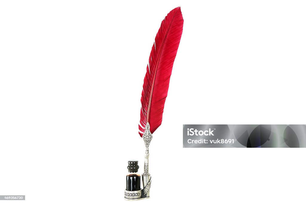 Quill pen Photo of a red feather quill pen and glass inkwell isolated on white background. Cut Out Stock Photo