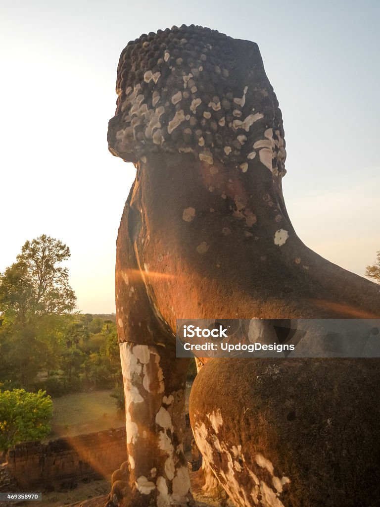 Cambodia Sun Sets on Pre Rup The setting sun illuminates one of the lion statues guarding the temple of Pre Rup, in Angkor Cambodia. Angkor is a UNESCO world heritage site and is one of the most important archaeological sites in South-East Asia.  2015 Stock Photo