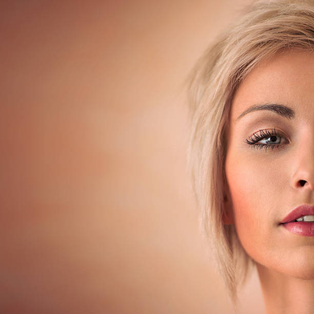 istock Elegant blonde beauty half face closeup portrait with copyspace 469359198