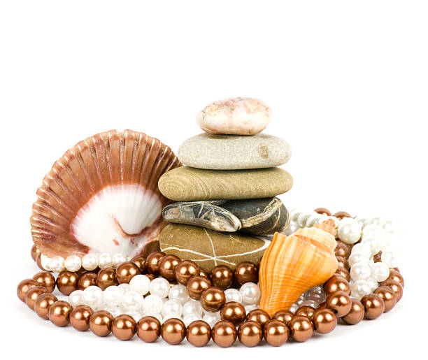 Against the background of a precious pearl and seashell stock photo