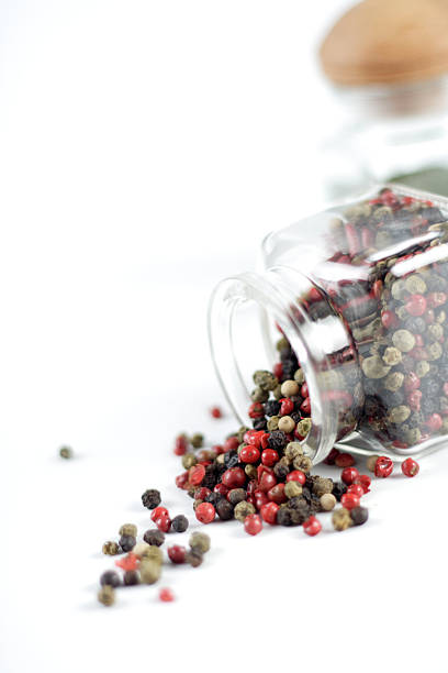 istock Mixed pepper seeds of various colours red black green 469364700