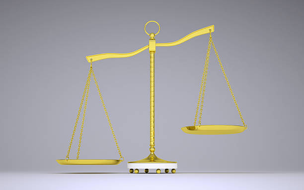 istock Gold beam balance with shadow. Left bowl below. Front view 469370550