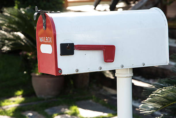 istock White Mail Box in Front of a House 469370756