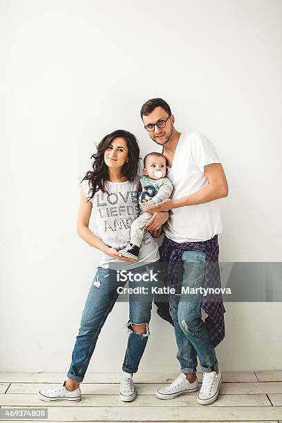 Hipster Father Mother Holding Cute Baby Boy Over White Backgrou Stock Photo - Download Image Now