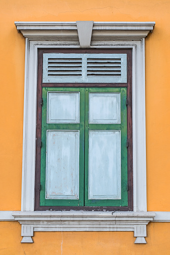 Vintage style window in front of building