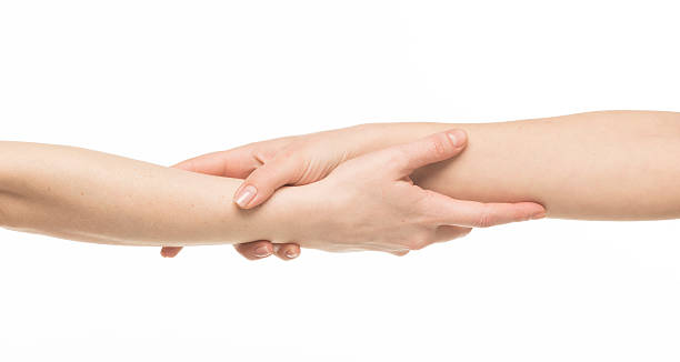 istock female hands holding on each other at the wrists 469381646