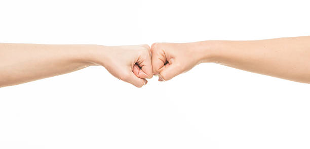 istock Two female fists hitting each other 469382032