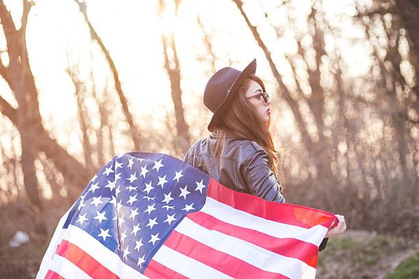Girl is waving american flag