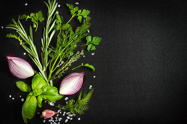 istock Black food background with fresh aromatic herbs and spices, copy 469385442