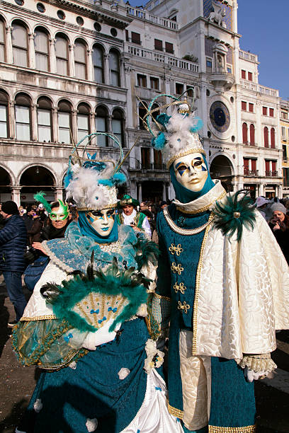 masked persons in costume on Carnival in Venice Venice, Italy - February 8, 2015: Two unidentified masked persons in costume on San Marco Square during the Carnival in Venice, Italy. mardi gras body painting stock pictures, royalty-free photos & images