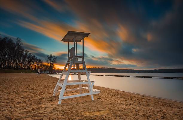 istock Lifeguard hut on lake shore. Long exposure photo 469390196