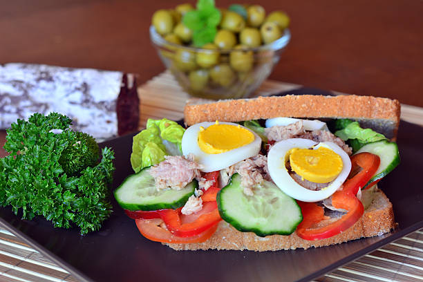 istock Rye bread sandwich with tuna fish, tomato and cucumber slices 469390604