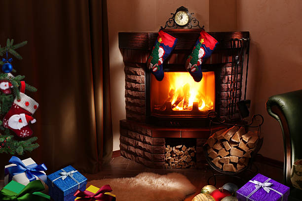 istock Christmas gifts by the fireplace. 469391094