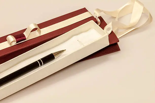 A pen in a gift box isolated