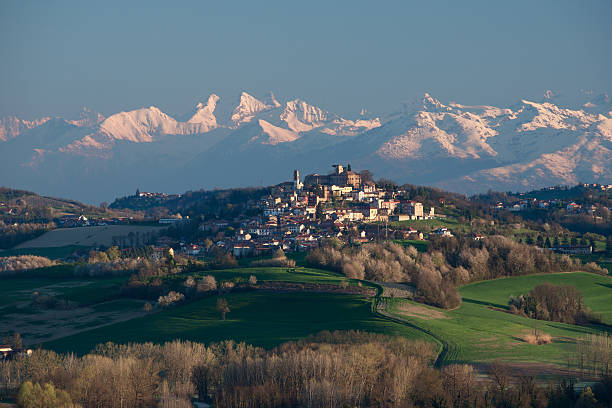 Montiglio Monferrato, the snow covered Alps on background, hilly landscape stock photo