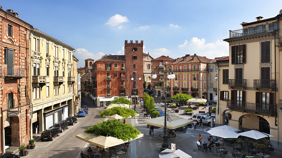 Piazza Statuto, Asti, Torre Guttuari on background, sunny day