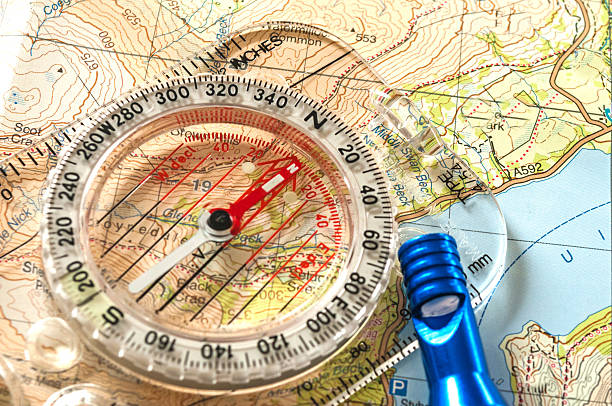 компас на карте и экстренная whistle - orienteering planning mountain climbing compass стоковые фото и изображения