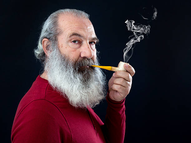 istock Senior portrait with white beard and pipe 469396684