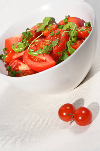 istock Close  - up of sliced tomatoes with rucola 469396948