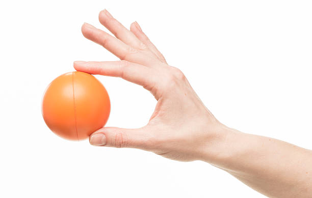 istock female hand with orange sponge ball 469401020