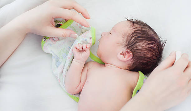 istock Newborn baby lying on a white diaper 469405544