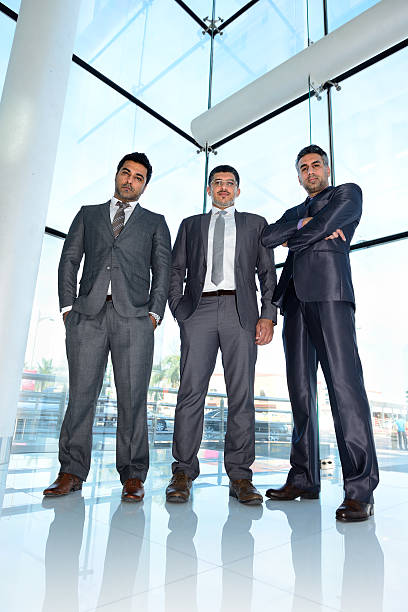 Three arab business men meeting, posing