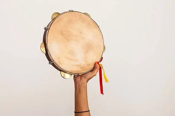 Photo of Hand holding tambourine