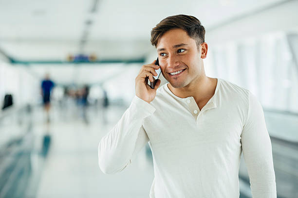 istock Young man talking on the phone indoors 469416426