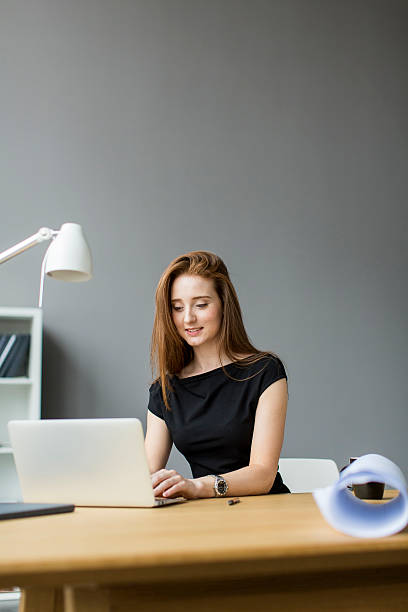 istock Young woman in the office 469419410