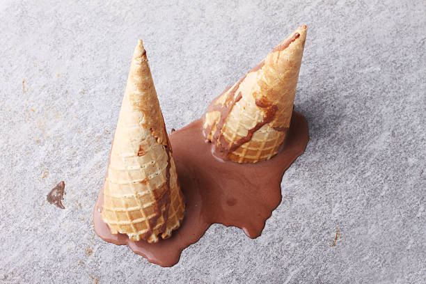 istock chocolate ice cream cones dropped melt on ground 469421246