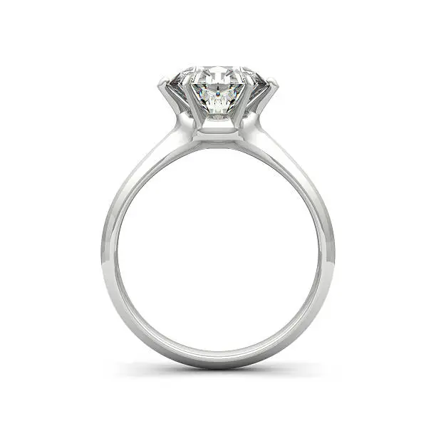 Photo of Isolated image of a diamond ring on a white background