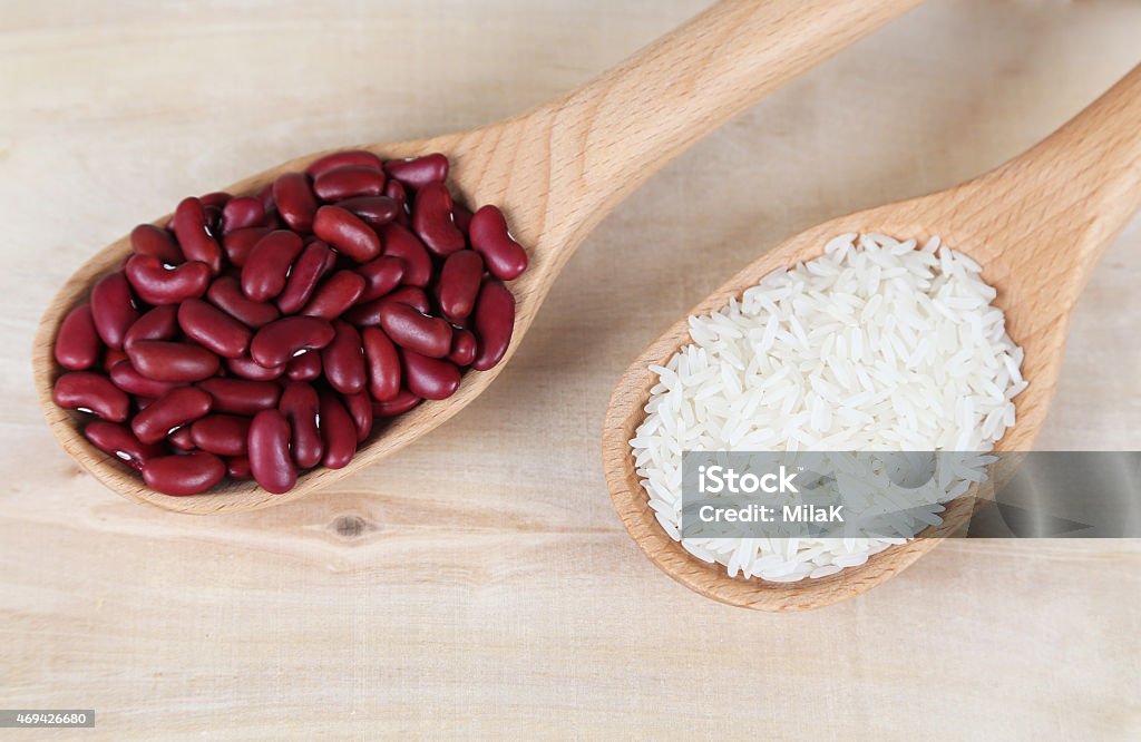 red beans and rice in a wooden spoons Agriculture Stock Photo