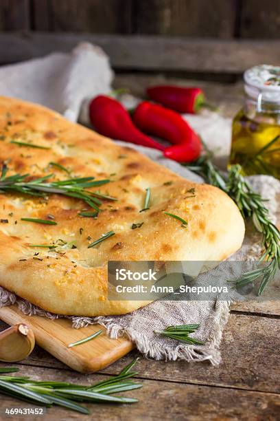 Italian Focaccia Bread With Rosemary And Garlic Stock Photo - Download Image Now - Focaccia Bread, Baked, Baking