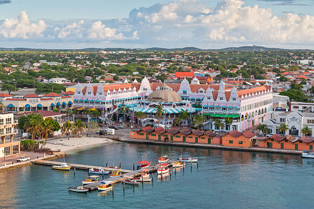 Harbour in Oranjestad in the morning sun, Aruba. Oranjestad, Aruba - December 01, 2011: View from above of colorful buildings in Oranjestad on the island of Aruba in the morning sun at December 01, 2011. leeward dutch antilles stock pictures, royalty-free photos & images