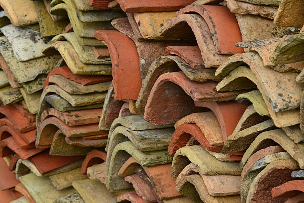 Old Charentaise farmhouse roof tiles stacked stock photo