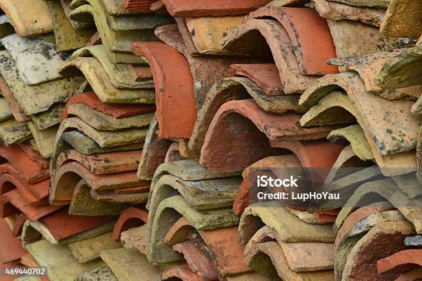 Old Charentaise Farmhouse Roof Tiles Stacked Stock Photo - Download Image Now - Abstract, Beige, Clay