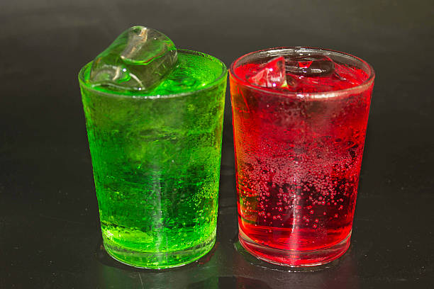 istock Red and green water and ice in a glass. 469444540